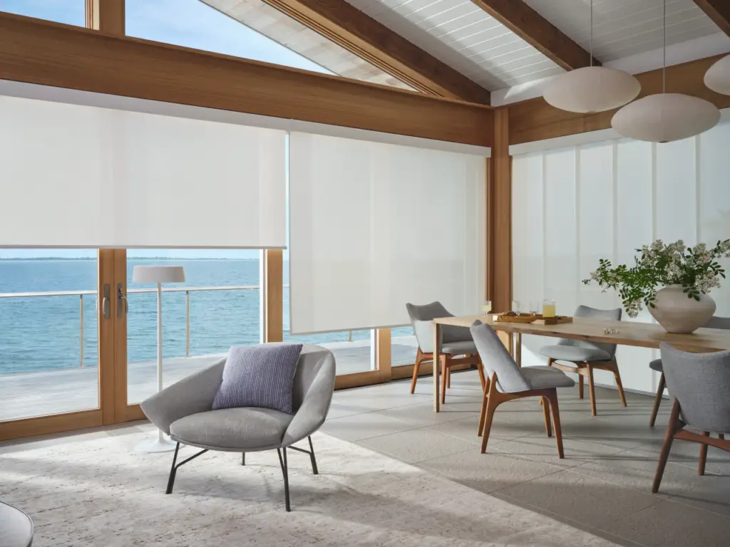Motorized shades and smart lighting integrated into a luxury smart home automation system.