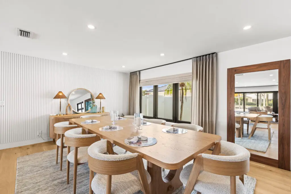 Dining room with automated window shades and home automation in South Florida.